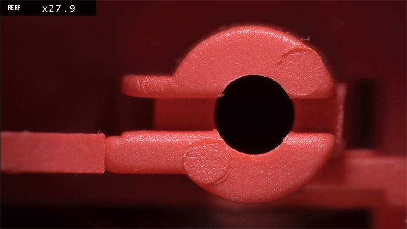 Screen shot of Orange plastic component under magnification