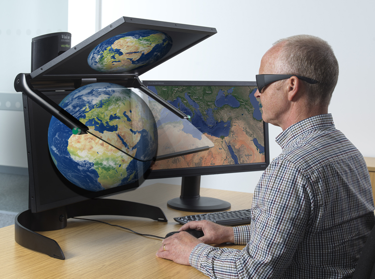 Man wearing 3D glasses looking at the globe using VECTOUR beamsplitter display