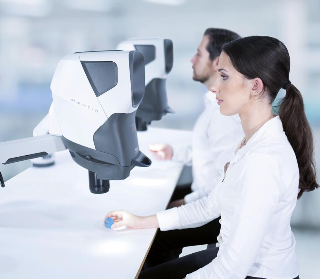 Dental technicians inspecting dental moulds using Mantis stereo microscope