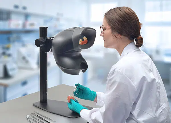 A set of dentures being inspected by the OPTA stereo microscope