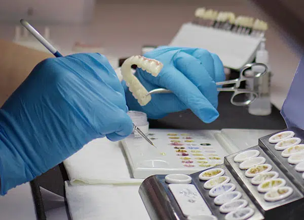 A set of dentures being colour matched
