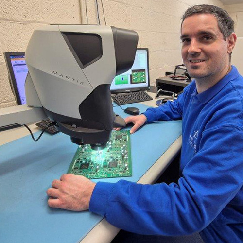 A technician using Mantis PIXO and looking towards camera