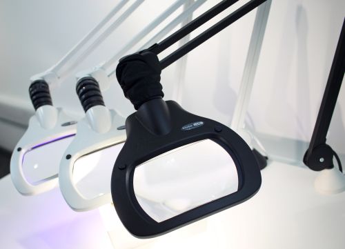 Three Vision LUXO bench magnifiers in a row