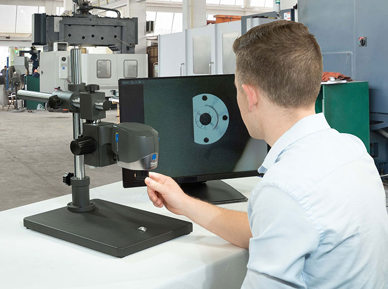 VE Cam digital-microscope being used by man for inspection on shop floor